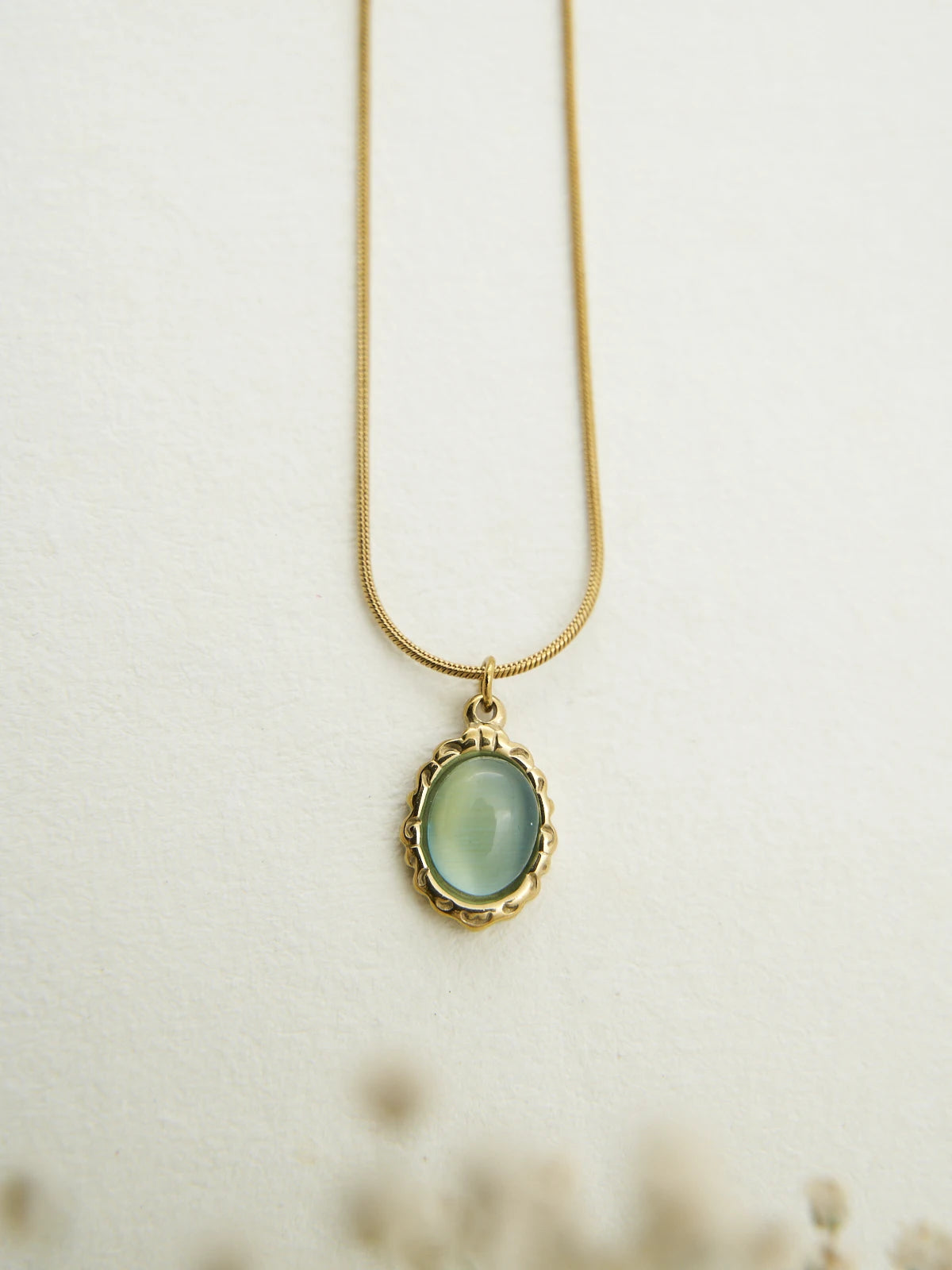 BLUISH GREEN OVAL SHINY STONE PENDANT - TARNISH FREE GOLD PLATED