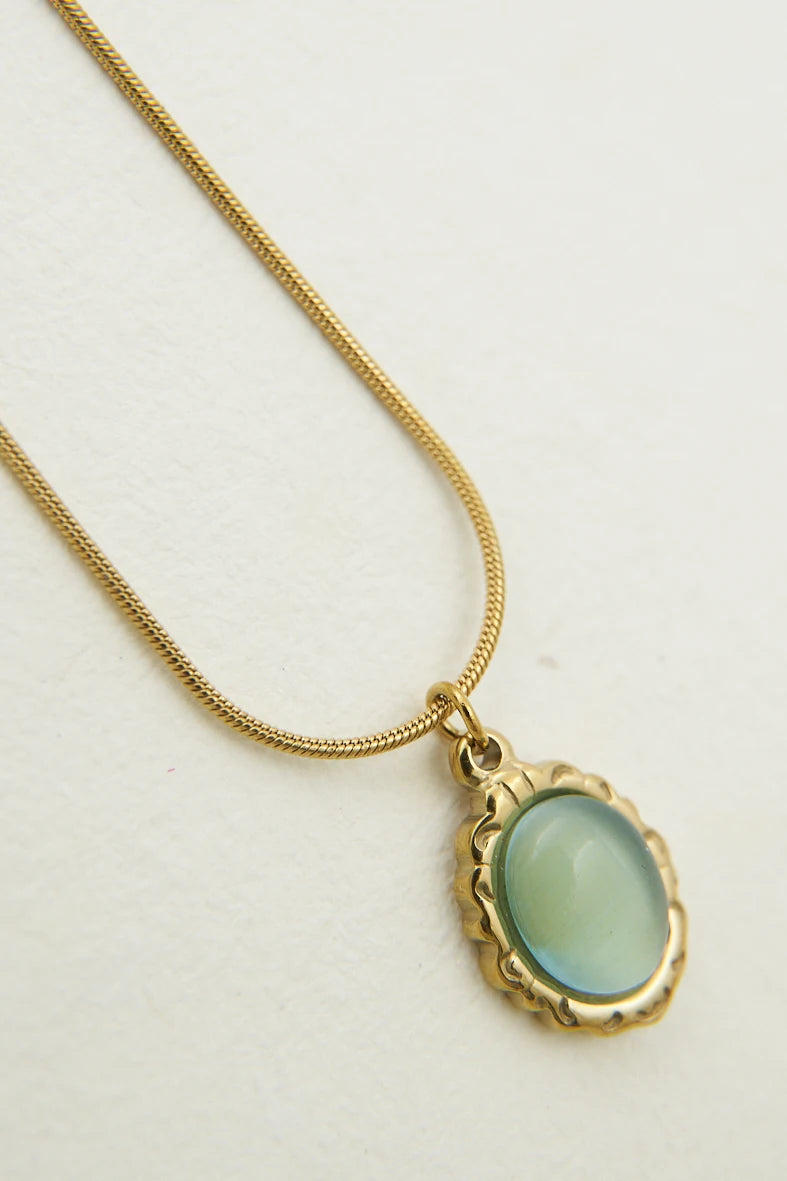 BLUISH GREEN OVAL SHINY STONE PENDANT - TARNISH FREE GOLD PLATED