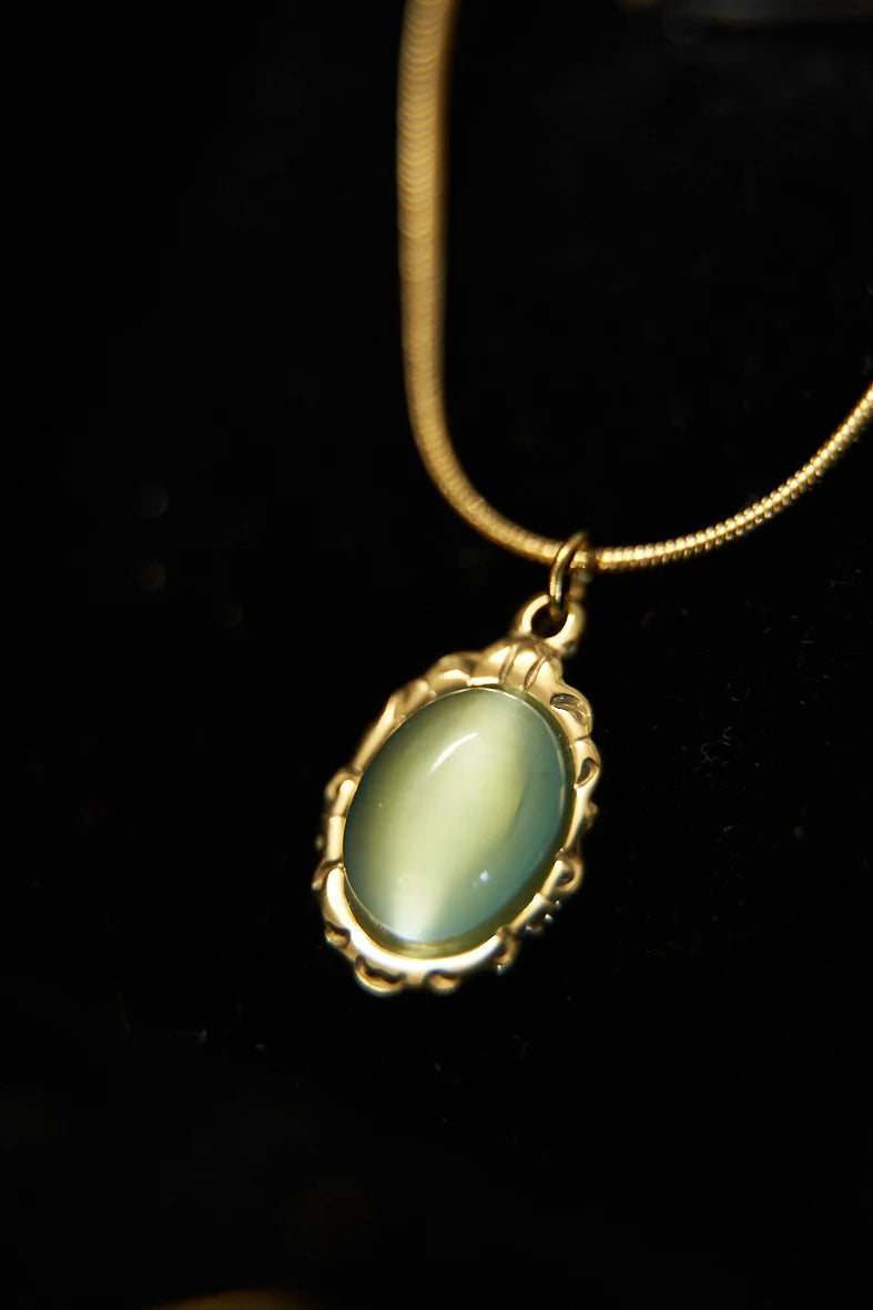 BLUISH GREEN OVAL SHINY STONE PENDANT - TARNISH FREE GOLD PLATED