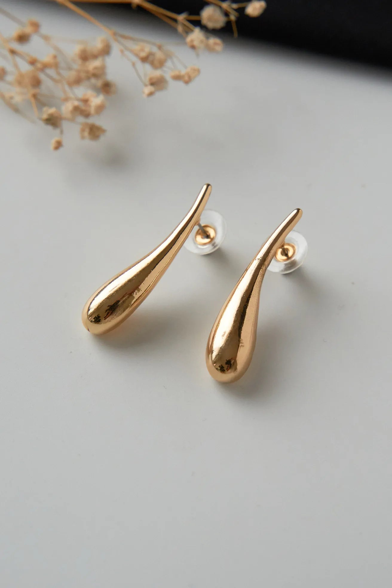 Long drop gold plated statement earrings