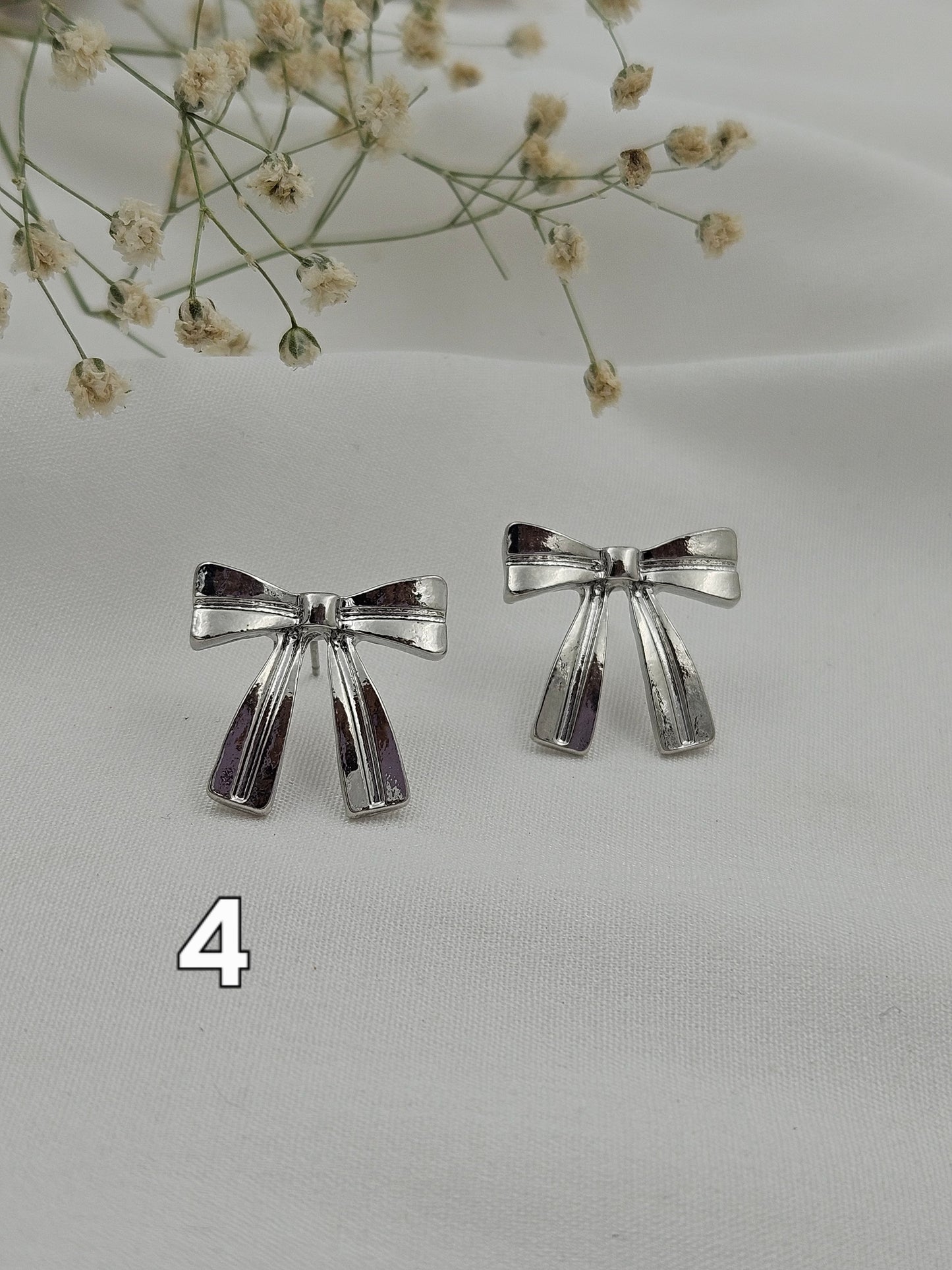 Silver bow pretty earrings