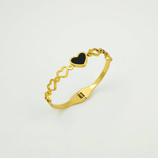 Heart in black bangle bracelet