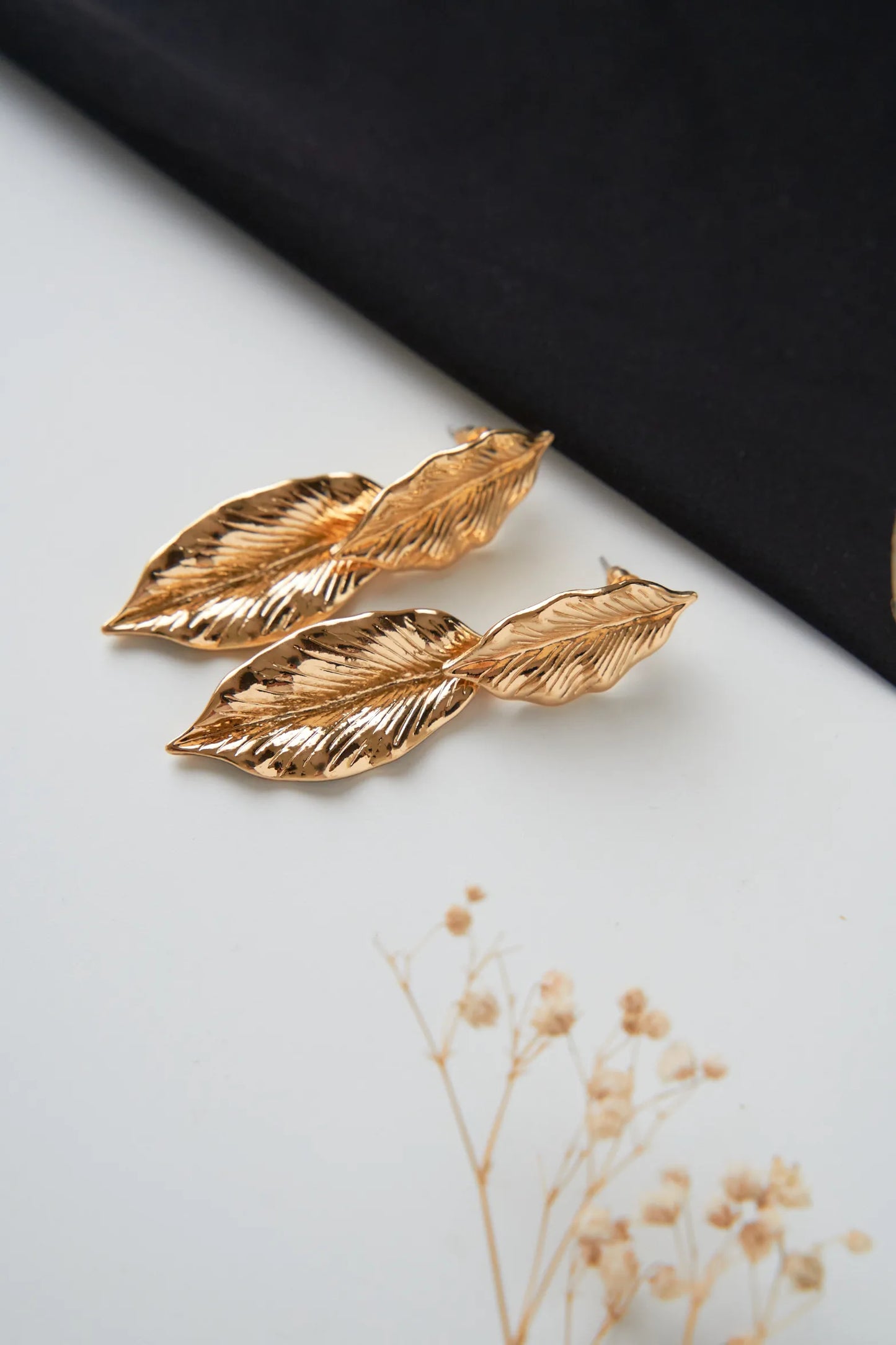 Women's leaf style hanging gold plated earrings