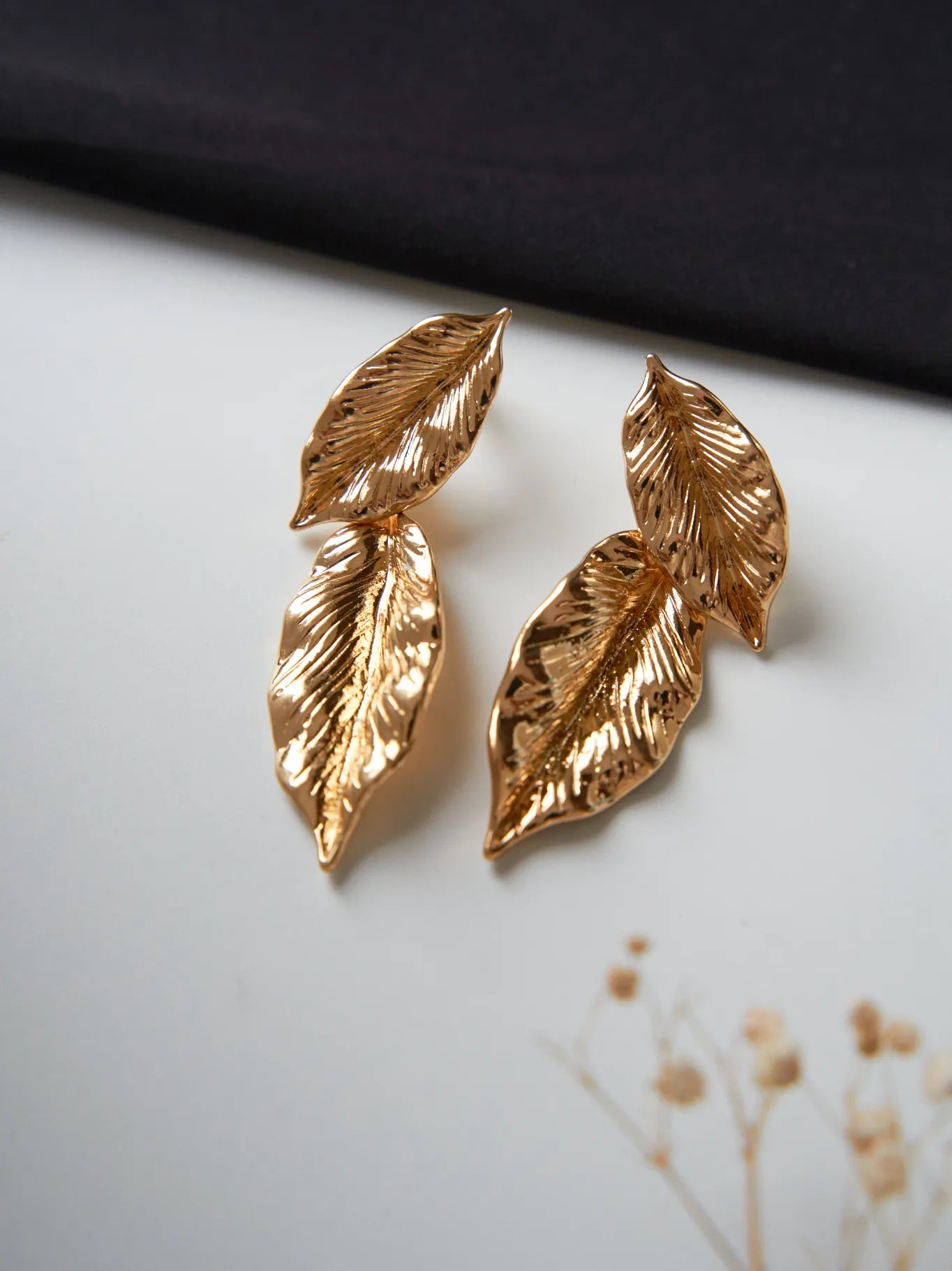 Women's leaf style hanging gold plated earrings